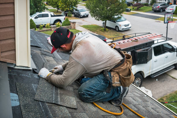 Professional Roof Replacement technician working in Bayside, WI